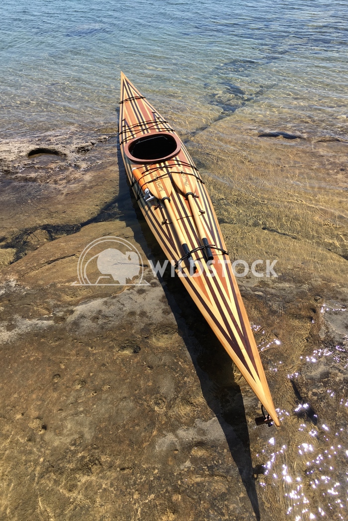 Wooden Kayak on Clear Water Jason Eke 