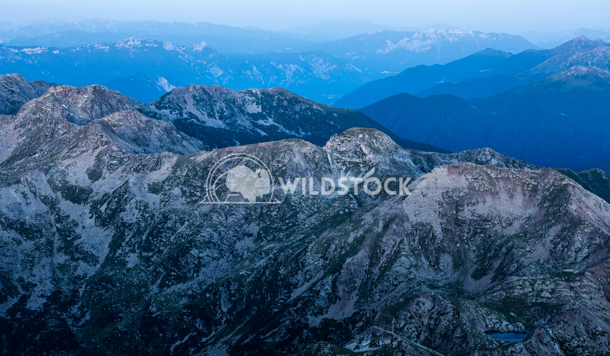 Blue Haze Vincentiu Solomon Mountain range just before sunrise in Trentino, Italy